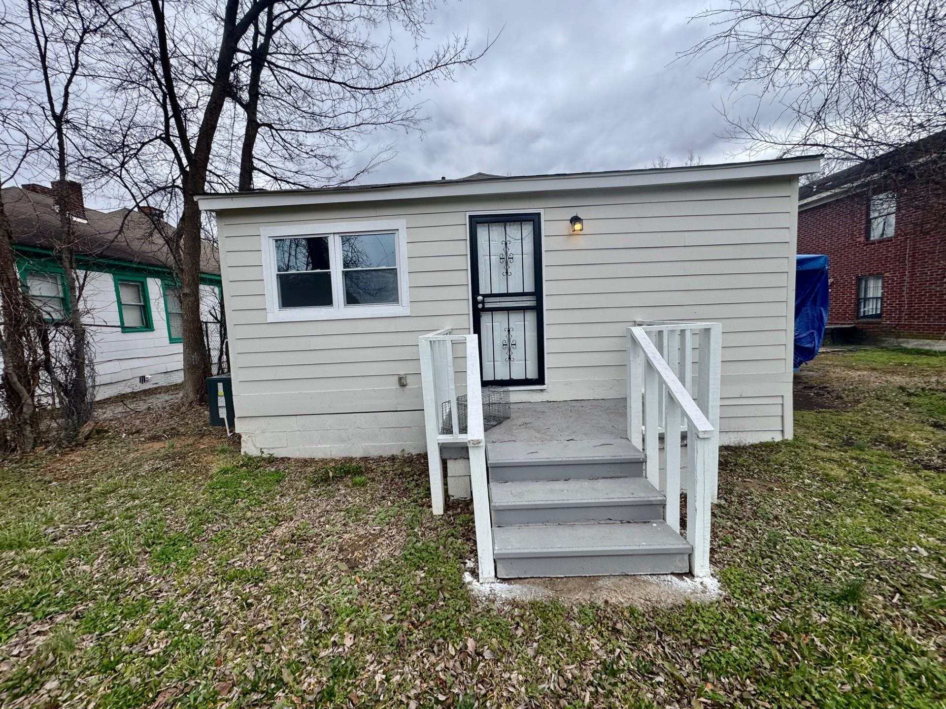 879 Tully Street Memphis, TN 38107 - Photo 10 of 12 a view of a house with a yard