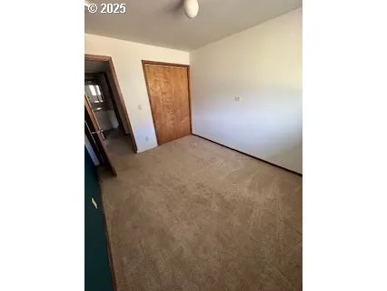 a view of a hallway with closet