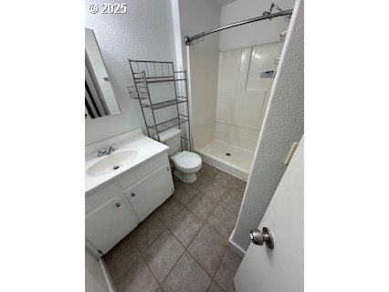 61476 Dee Cox Road Heppner, OR 97836 - Photo 17 of 43 a bathroom with a double vanity sink toilet and shower