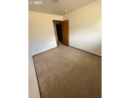 a view of a livingroom and window