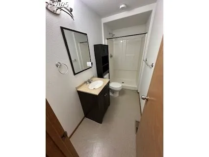 a view of a room with a window and brick wall