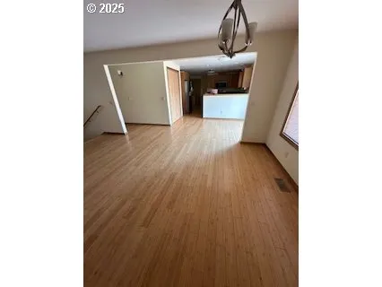 a view of a livingroom with wooden floor