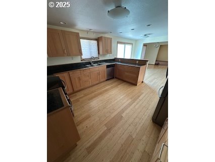 61476 Dee Cox Road Heppner, OR 97836 - Photo 8 of 43 a large room with a lot of cabinets and wooden floor
