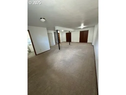 a view of a room with window and stairs