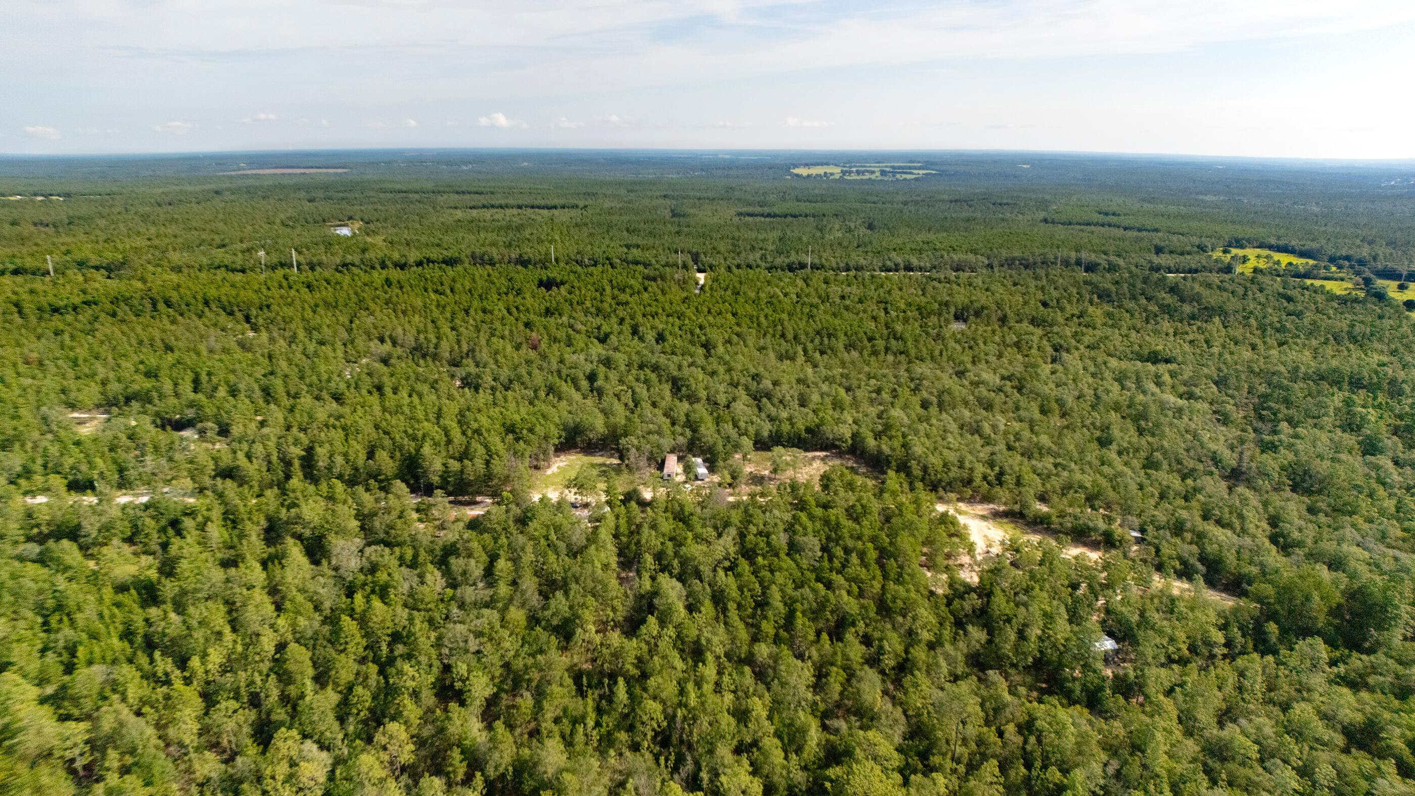 7-8 Tarpon Lane DeFuniak Springs, FL 32433 - Photo 12 of 18 a view of a green field with an ocean
