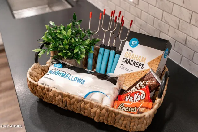 a table with chairs and a potted plant