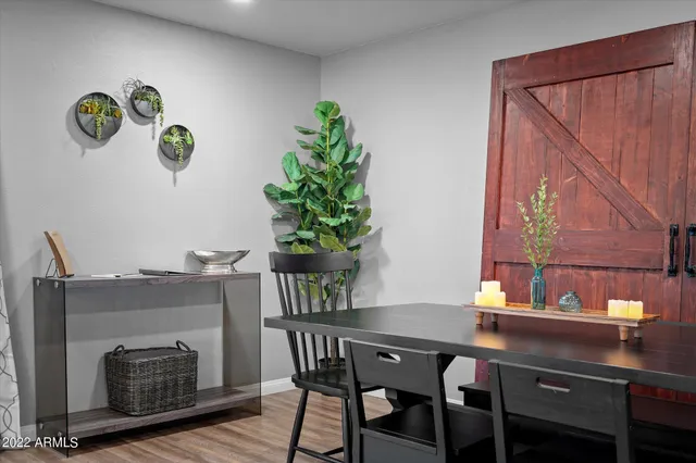 a dining room with a table and chairs