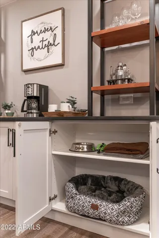a kitchen with a stove and cabinets