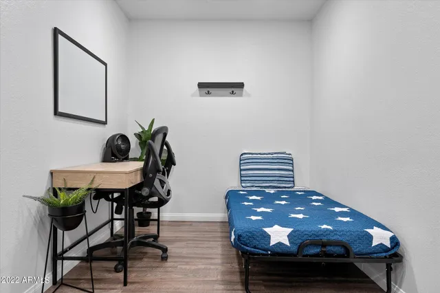 a room with furniture and wooden floor