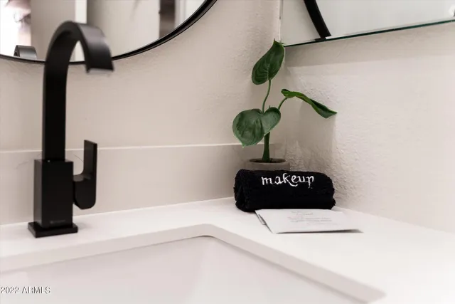 a close view of a vase of flowers sitting on a counter