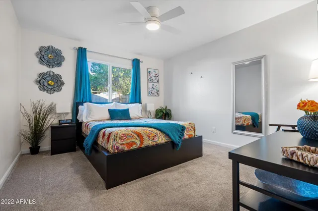 a bed room with furniture and a window