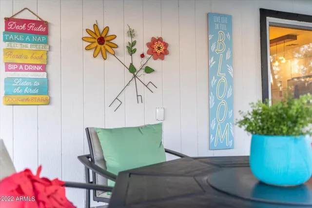 a view of a room with furniture and a potted plant