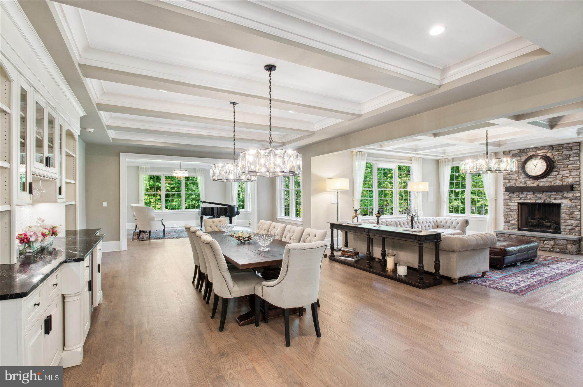 6804 Benjamin Street McLean, VA 22101 - Photo 26 of 68 a view of a dining room with furniture large windows and wooden floor