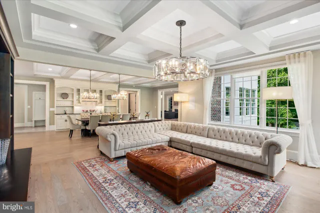 a view of a livingroom with wooden floor and staircase