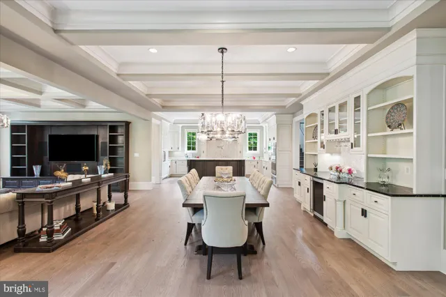 a spacious bedroom with a bed and a flat screen tv