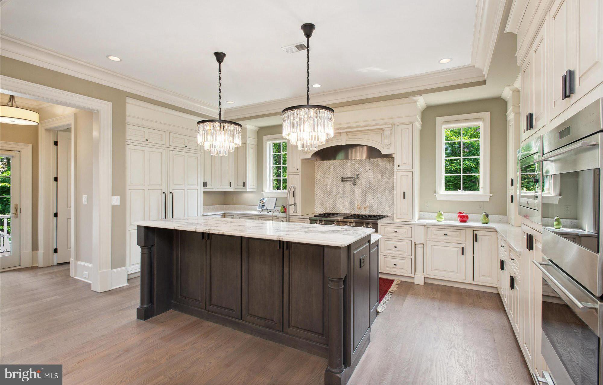 6804 Benjamin Street McLean, VA 22101 - Photo 31 of 68 a kitchen with a sink stove and refrigerator