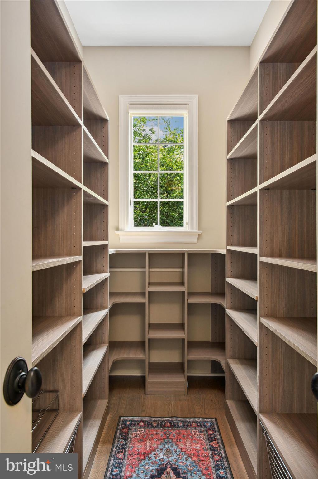 6804 Benjamin Street McLean, VA 22101 - Photo 32 of 68 a view of walk in closet with empty racks