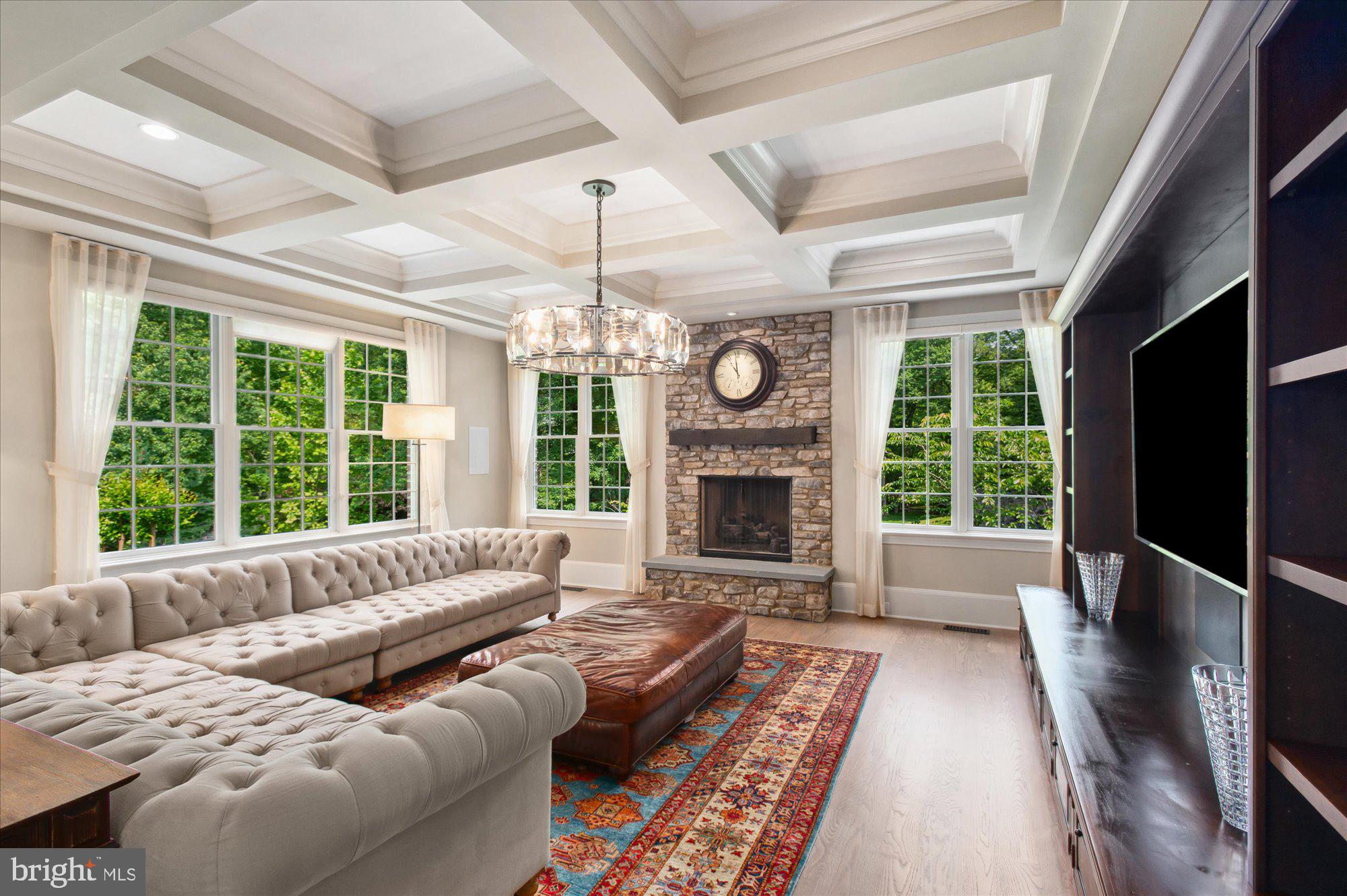 6804 Benjamin Street McLean, VA 22101 - Photo 34 of 68 a living room with furniture fireplace and a large window