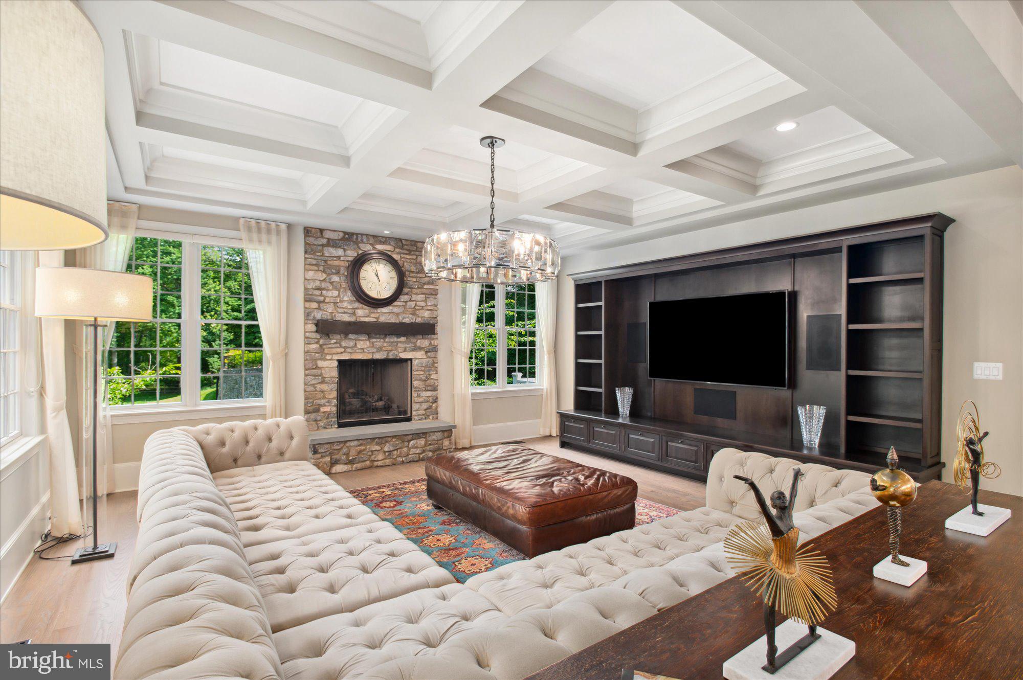 6804 Benjamin Street McLean, VA 22101 - Photo 35 of 68 a living room with furniture a fireplace and a flat screen tv