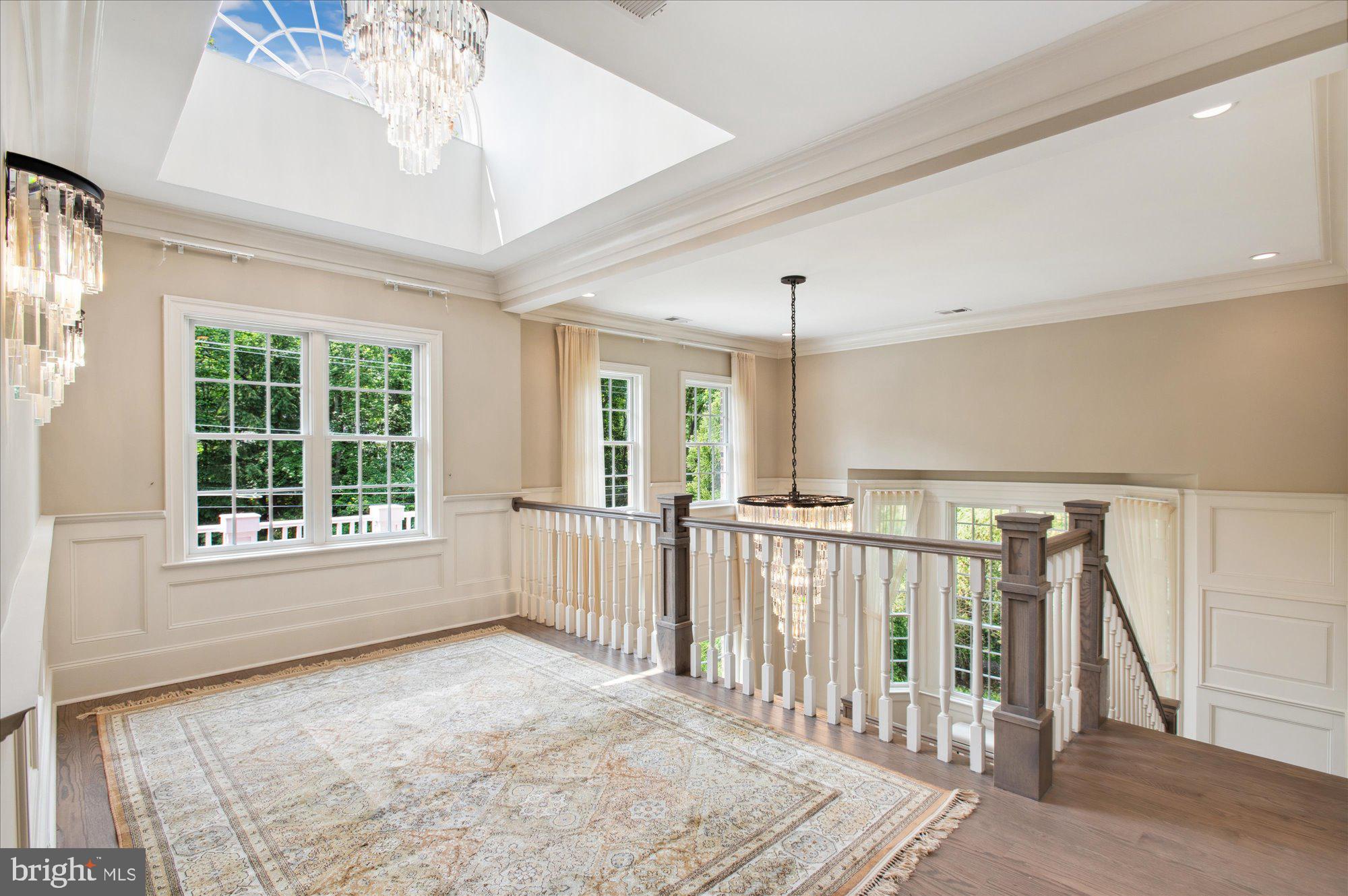 6804 Benjamin Street McLean, VA 22101 - Photo 38 of 68 a view of a livingroom with wooden floor and staircase