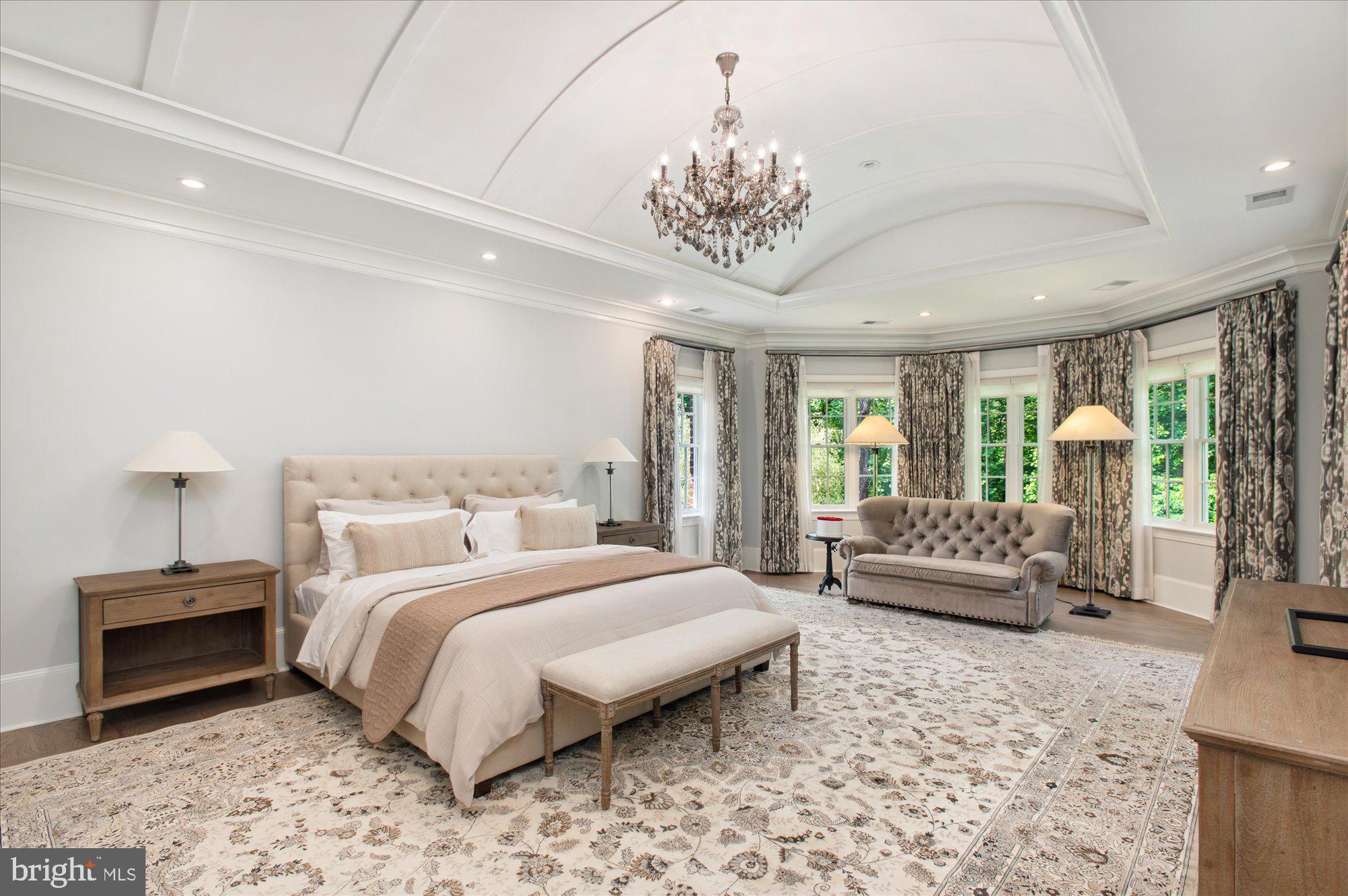 6804 Benjamin Street McLean, VA 22101 - Photo 40 of 68 a bedroom with a bed a couch and dresser