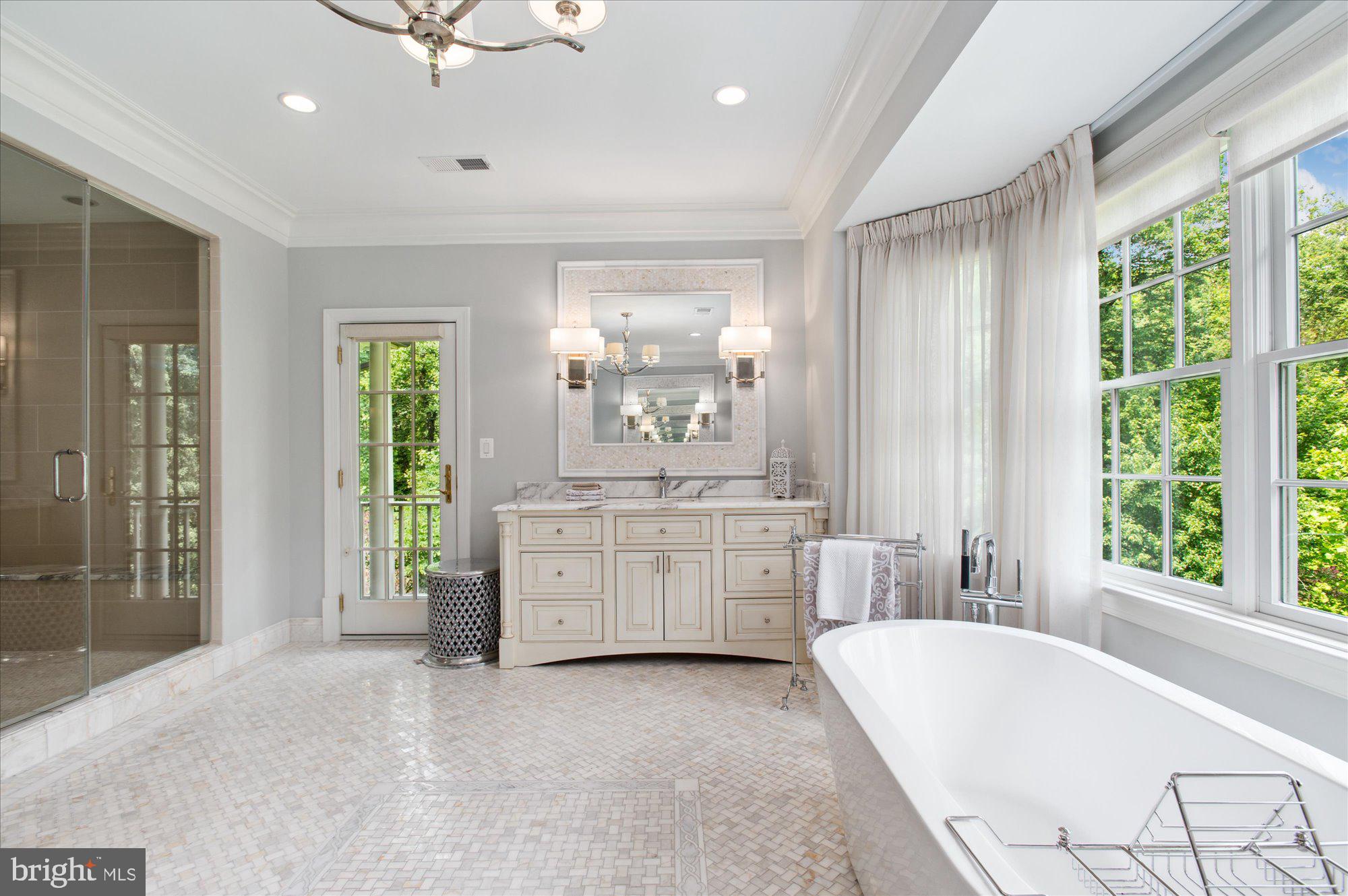 6804 Benjamin Street McLean, VA 22101 - Photo 45 of 68 a large spacious bathroom with a large tub shower and sink