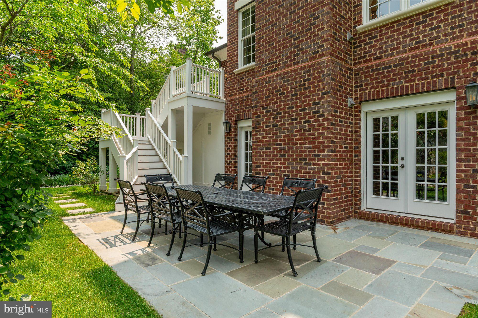 6804 Benjamin Street McLean, VA 22101 - Photo 52 of 68 a view of a patio with table and chairs with wooden floor and fence