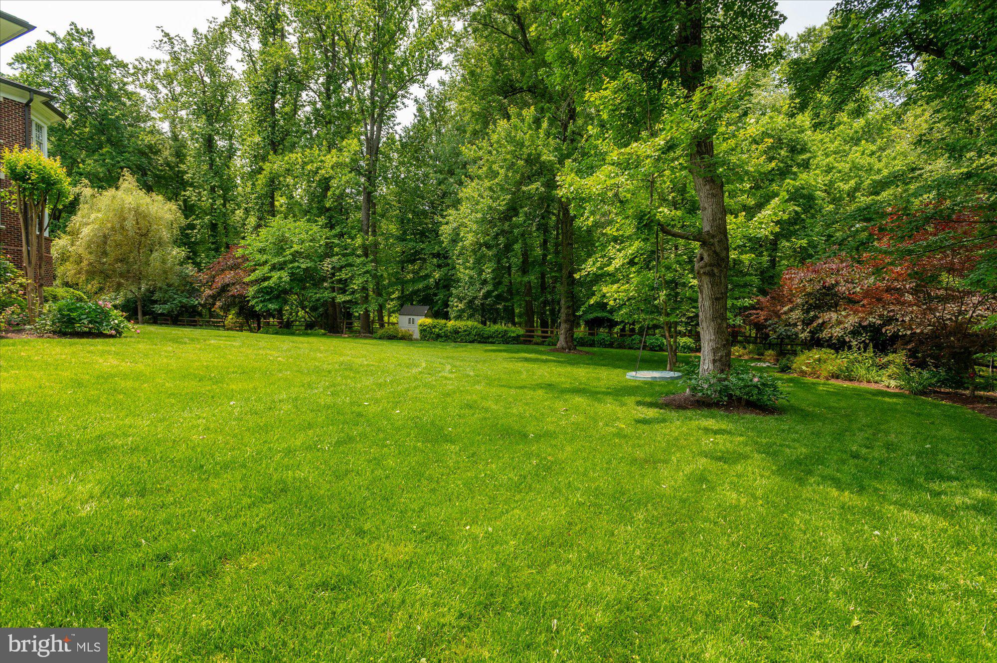 6804 Benjamin Street McLean, VA 22101 - Photo 66 of 68 a view of a grassy field with trees in the background