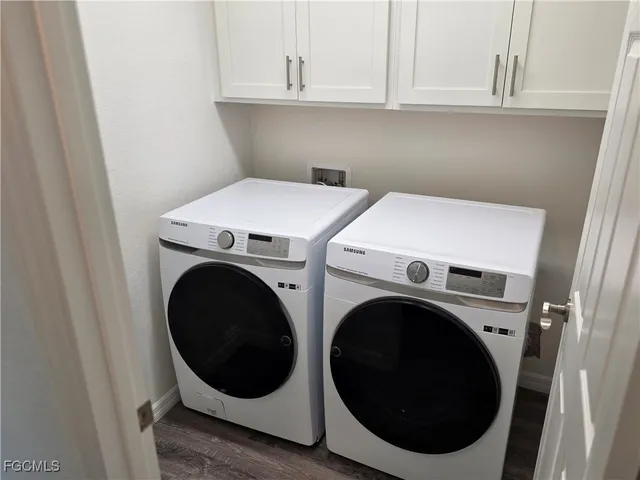 a utility room with dryer and washer