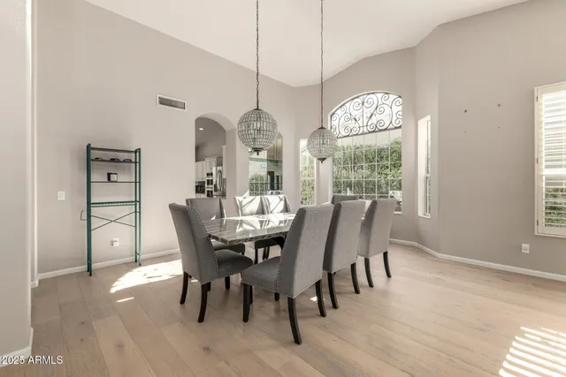 a view of a dining room with furniture window and wooden floor
