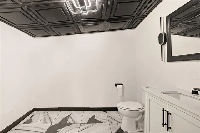 a bathroom with a toilet and a sink