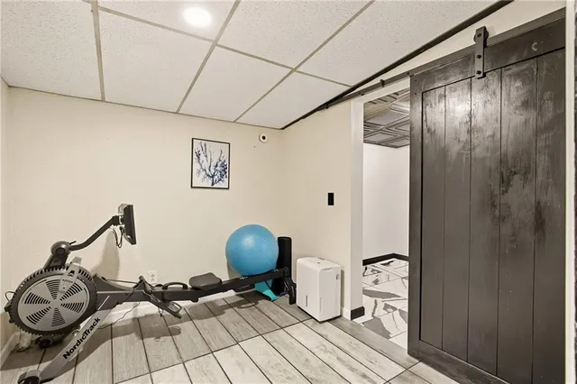 a view of a workspace with wooden floor