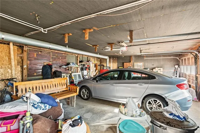 a view of parking garage with cars parked