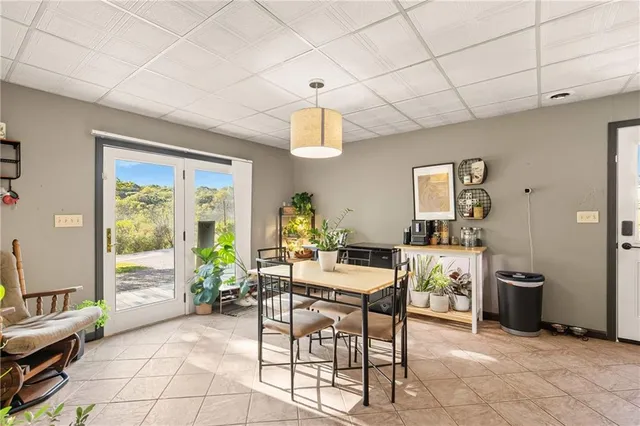 a work room with furniture and a window