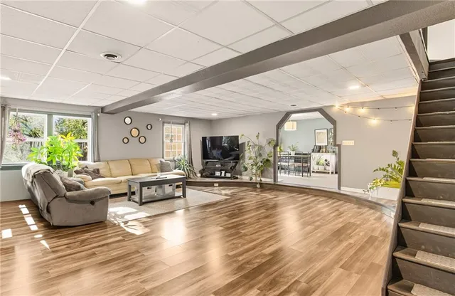 a living room with furniture and a large window