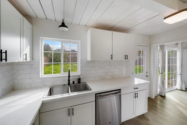 a kitchen that has a sink and a window