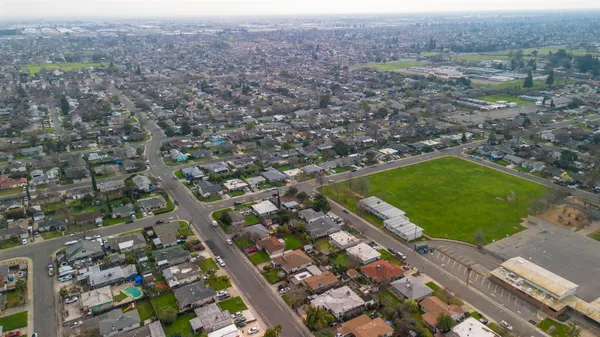 an aerial view of residential houses with outdoor space