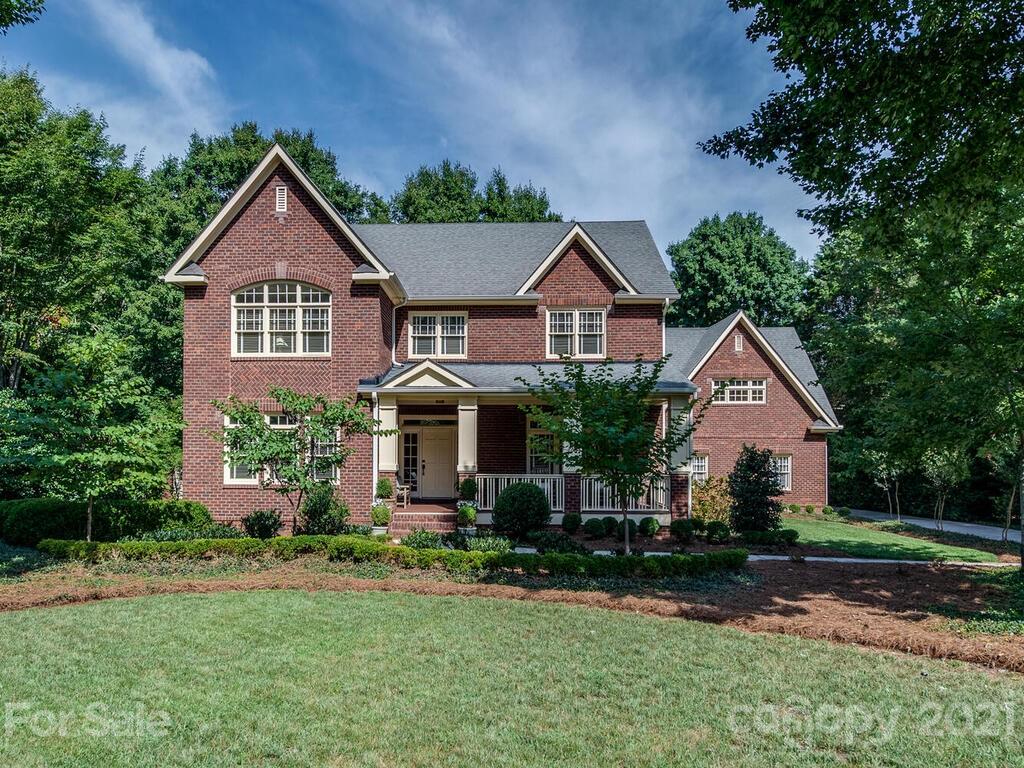 4608 Nora's Path Road Charlotte, NC 28226 - Photo 2 of 39 front view of house with a yard and large trees