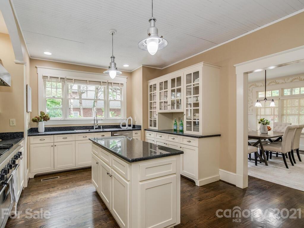 4608 Nora's Path Road Charlotte, NC 28226 - Photo 11 of 39 a kitchen with stainless steel appliances granite countertop a stove a sink and a refrigerator
