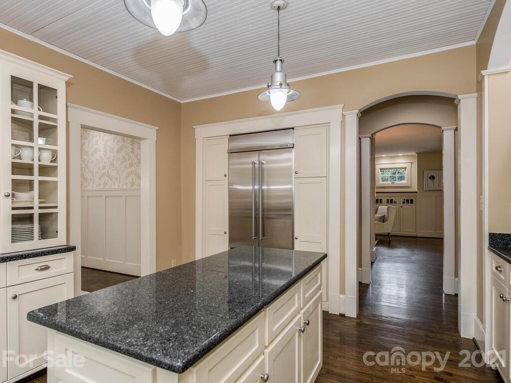 4608 Nora's Path Road Charlotte, NC 28226 - Photo 12 of 39 a kitchen with stainless steel appliances granite countertop a sink and a refrigerator