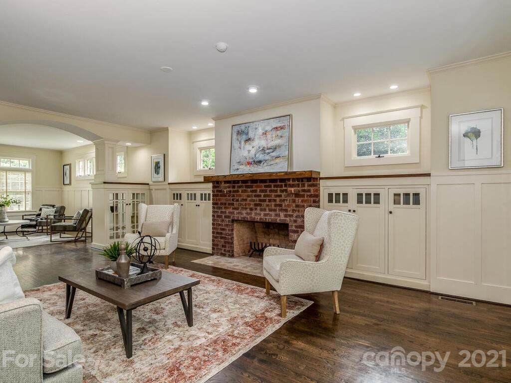 4608 Nora's Path Road Charlotte, NC 28226 - Photo 14 of 39 a living room with furniture a fireplace and a table