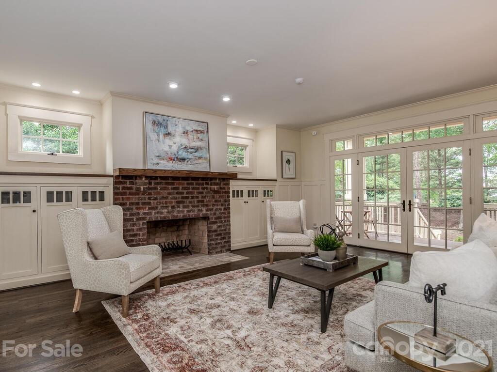 4608 Nora's Path Road Charlotte, NC 28226 - Photo 16 of 39 a living room with furniture and a fireplace