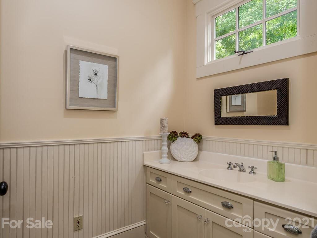 4608 Nora's Path Road Charlotte, NC 28226 - Photo 18 of 39 a bathroom with a sink and a mirror