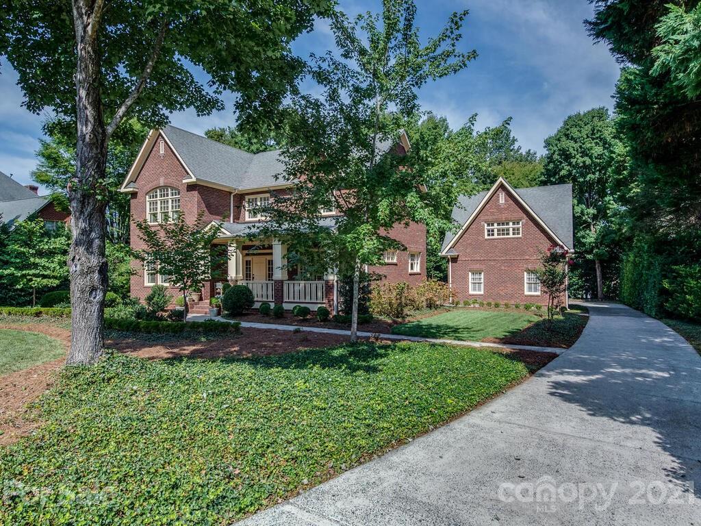 4608 Nora's Path Road Charlotte, NC 28226 - Photo 3 of 39 a front view of a house with a yard and garage