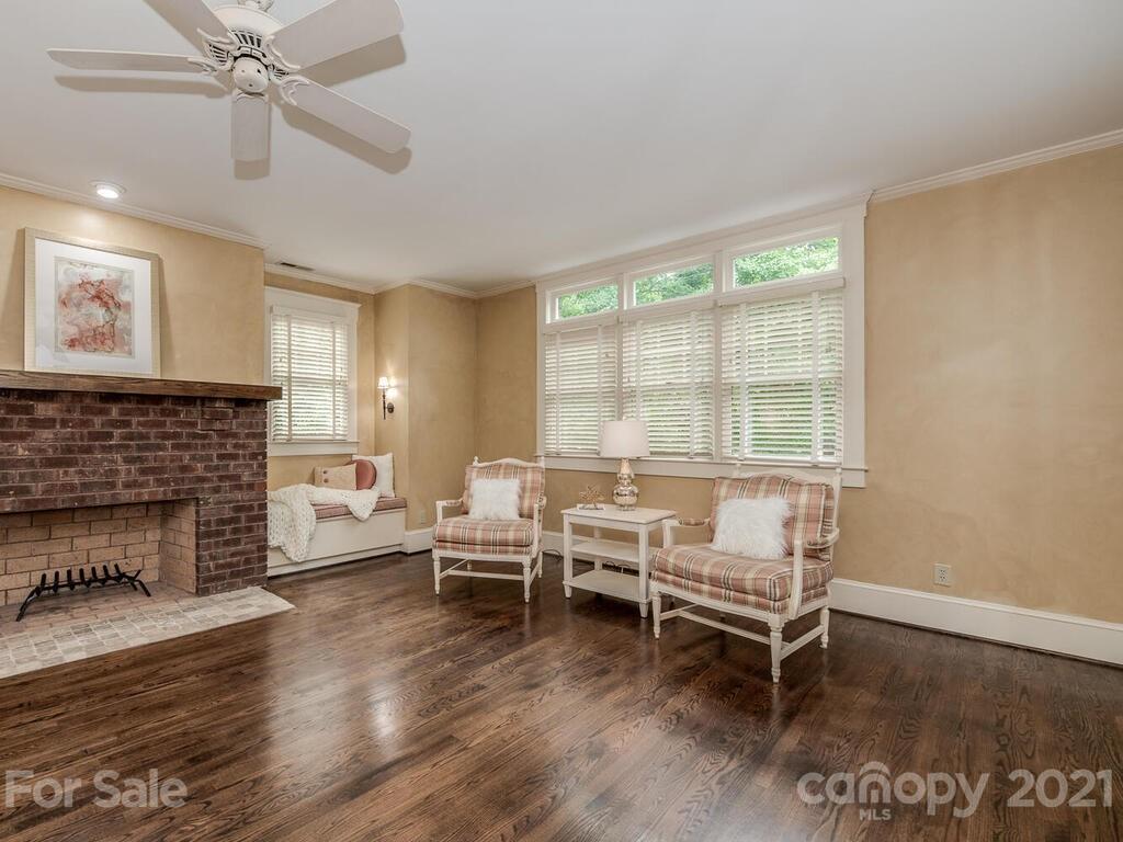 4608 Nora's Path Road Charlotte, NC 28226 - Photo 21 of 39 a living room with furniture and a fireplace
