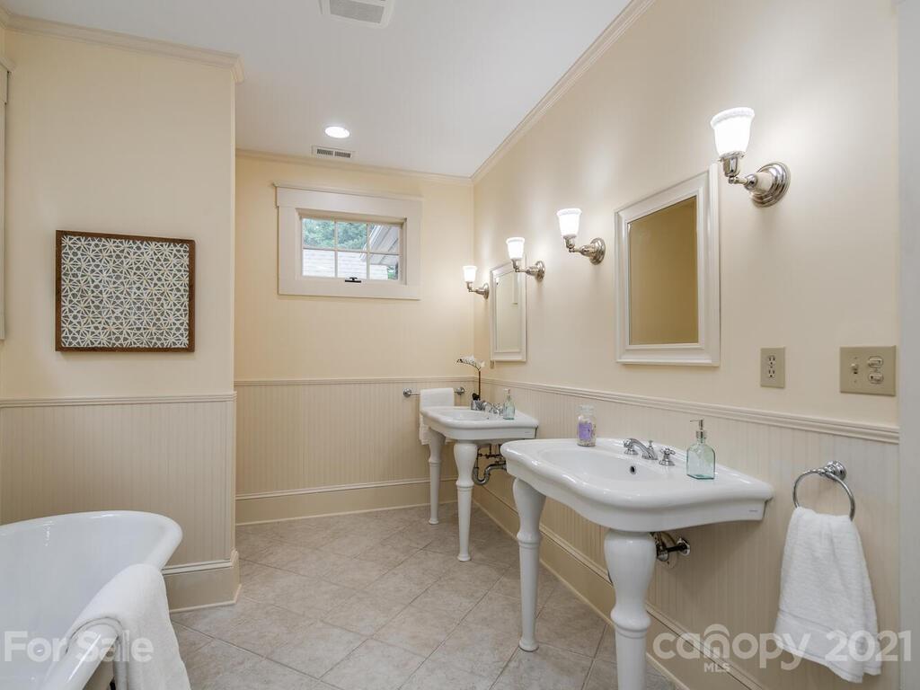 4608 Nora's Path Road Charlotte, NC 28226 - Photo 22 of 39 a bathroom with a toilet sink and mirror