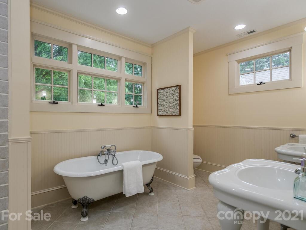 4608 Nora's Path Road Charlotte, NC 28226 - Photo 24 of 39 a bathroom with a sink and a mirror