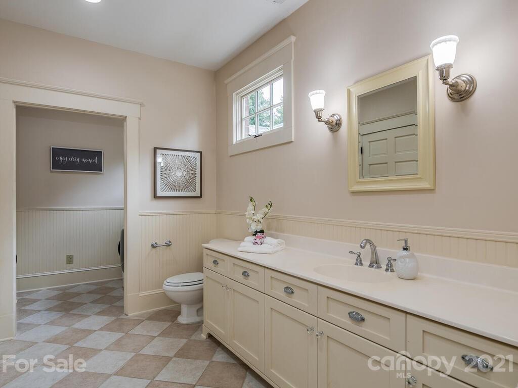 4608 Nora's Path Road Charlotte, NC 28226 - Photo 26 of 39 a bathroom with a sink toilet and a mirror