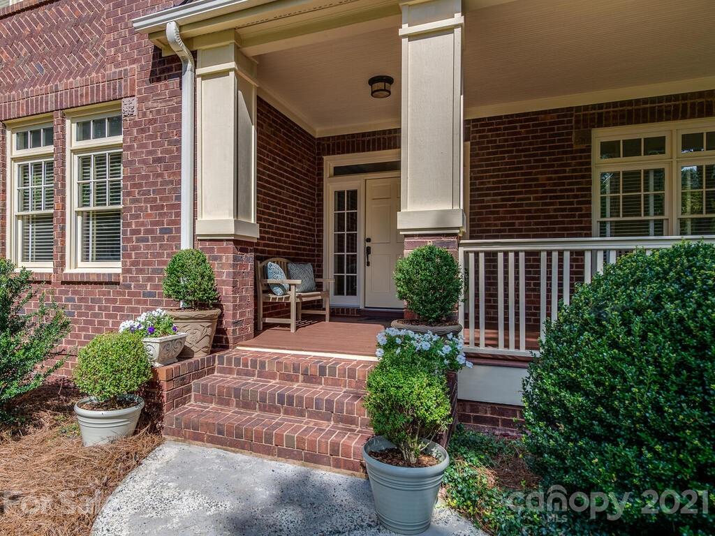 4608 Nora's Path Road Charlotte, NC 28226 - Photo 4 of 39 a front view of a house with potted plants