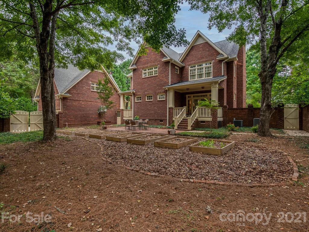 4608 Nora's Path Road Charlotte, NC 28226 - Photo 33 of 39 a front view of a house with garden